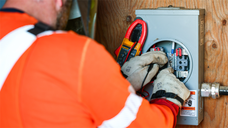 Person changing electrical metre