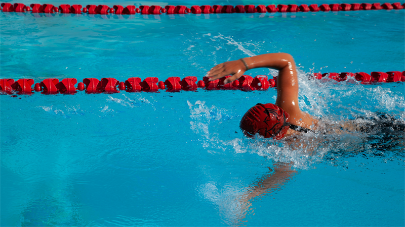 Person swimming laps in a pool