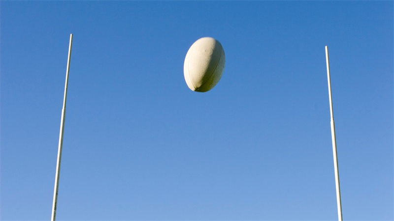 Rugby ball flying through the air